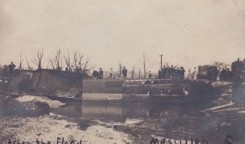 People standing by fallen train, Massillon, Ohio, 1913