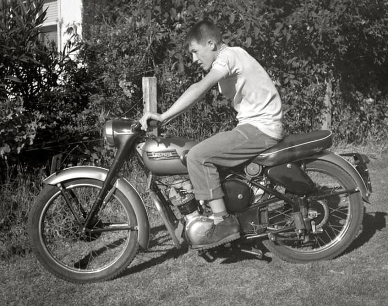 Young lad posing with his Triumph motorcycle, somewhere in Victoria, Australia, May 1959