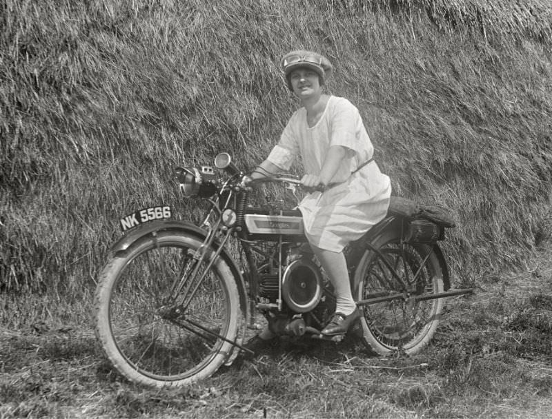 Damsel on a Douglas motorcycle, somewhere in England, 1920s