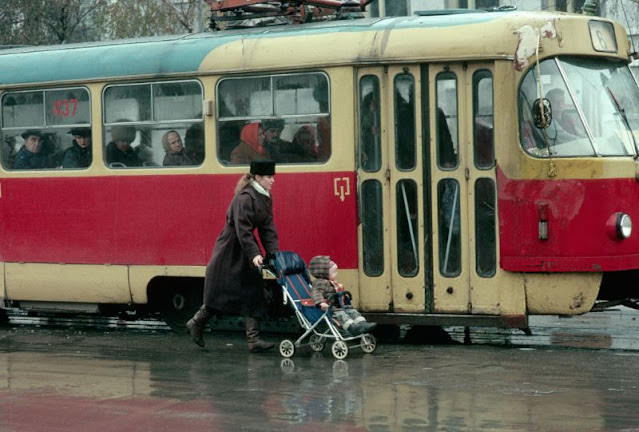Young mother and child boarding a tram in Lviv, Ukraine, 1991