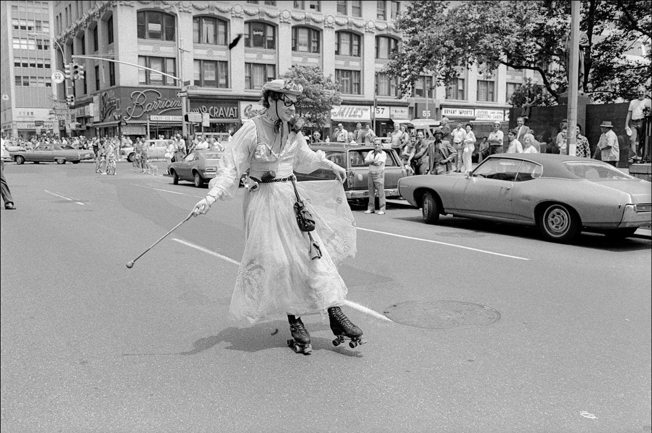 Roller Skater in Ankle-Length Dress at Gay Pride Parade, New York, 1975