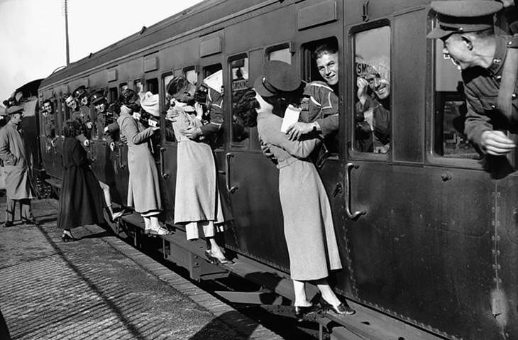 Soldiers kissing loved ones before Egypt deployment, 1935.