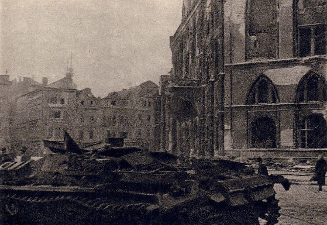 Destroyed German tank in Prague's Old Town Square, 1945.
