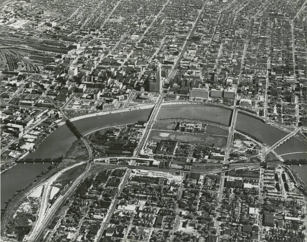 Aerial view of Columbus, looking east across Franklinton, the Scioto River, and downtown, circa 1950.