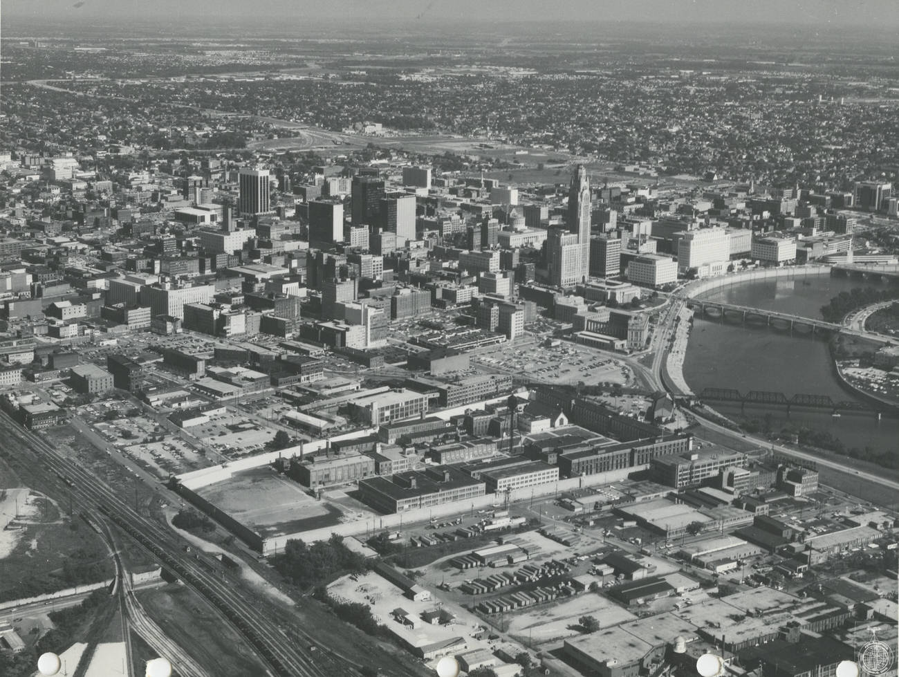 Aerial view of downtown Columbus looking southeast, featuring Ohio Penitentiary and future Arena District, 1971.