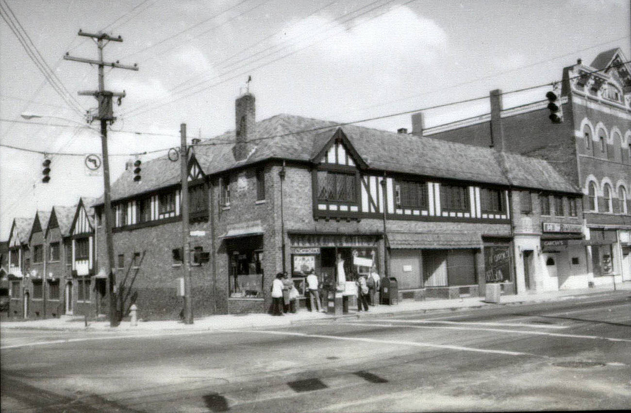 Businesses along west side of North High Street between West Hudson and the alley, including Benchworks Art Gallery, James H. Jewett law office, Garcia's International Restaurant, Apocalypse Records, Karen Wickliff Books, Artists Workshop Gallery, Schreiner Plumbing and Hardware, Circa 1980s