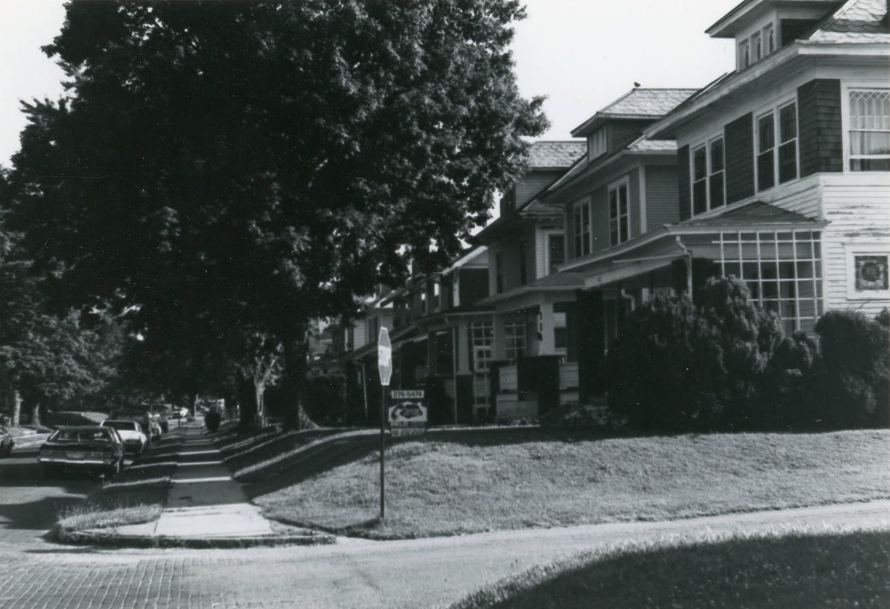 Photo of the corner of Grace St. and Eldon Ave, with 116 Eldon Ave., for the Greater Hilltop Area Commission's guide, 1980s