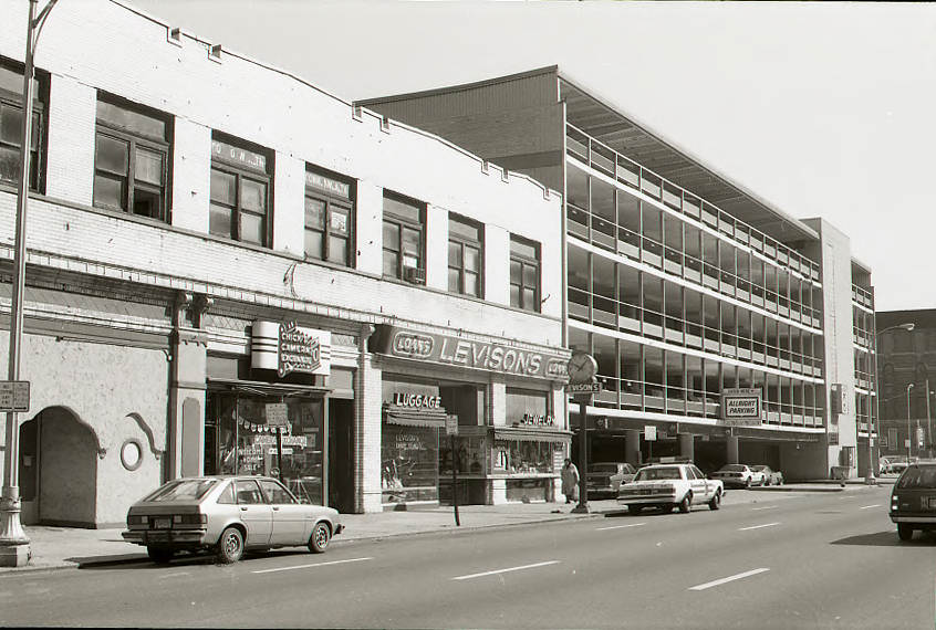 Chick's Camera Exchange, Levison's pawnbroker, and Allright Parking on East Long Street, 1986.