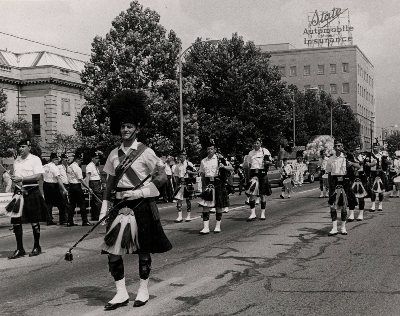 Drum Major David Breese and Capital City Pipes and Drums in parade, Columbus, 1990s