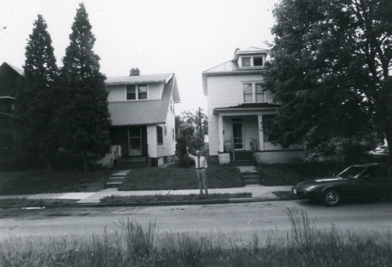 249 and 253 S. Burgess Ave., with an unidentified man waving, featured in the Greater Hilltop Area Commission's guide, 1980s.