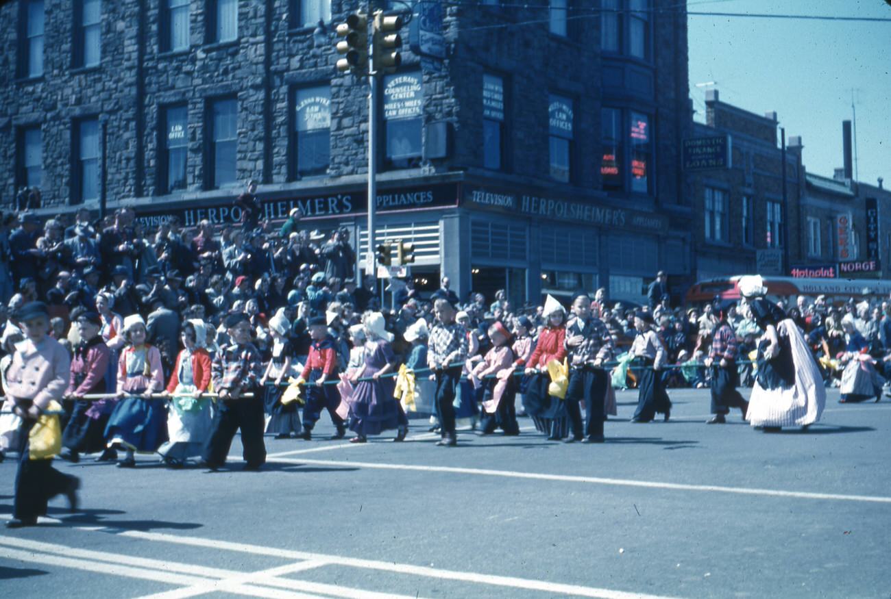 Parade in Holland, Michigan, featuring children in Dutch costume, 1950s