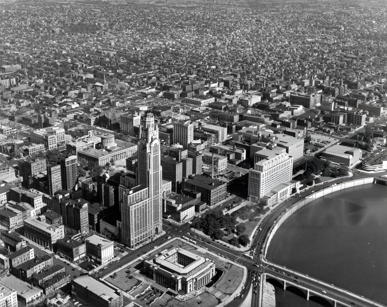 Aerial view of downtown Columbus, Ohio, looking southeast with City Hall, LeVeque-Lincoln Tower, and Departments of State Building in the foreground, 1955