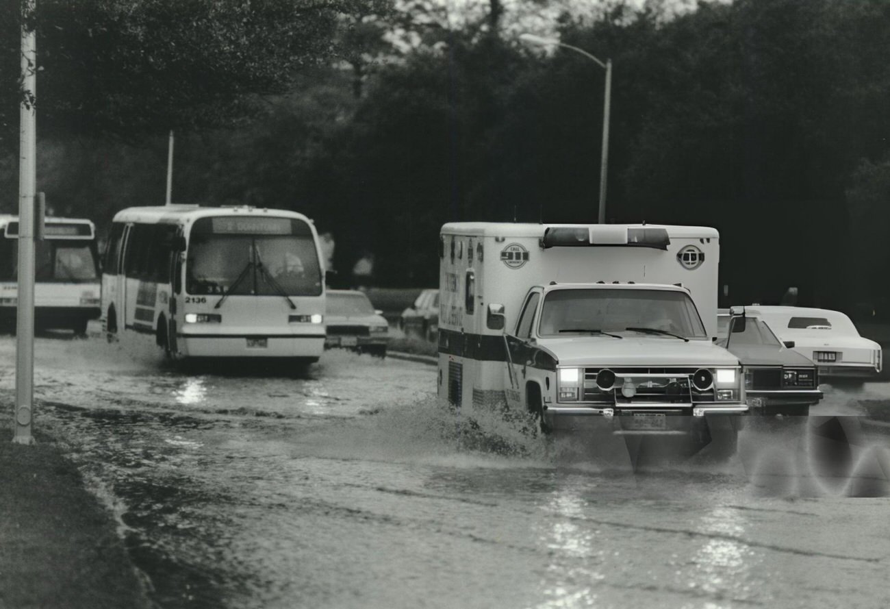 Rain disrupts traffic on Fannin near Hermann Park during thunderstorms, Houston, Texas.