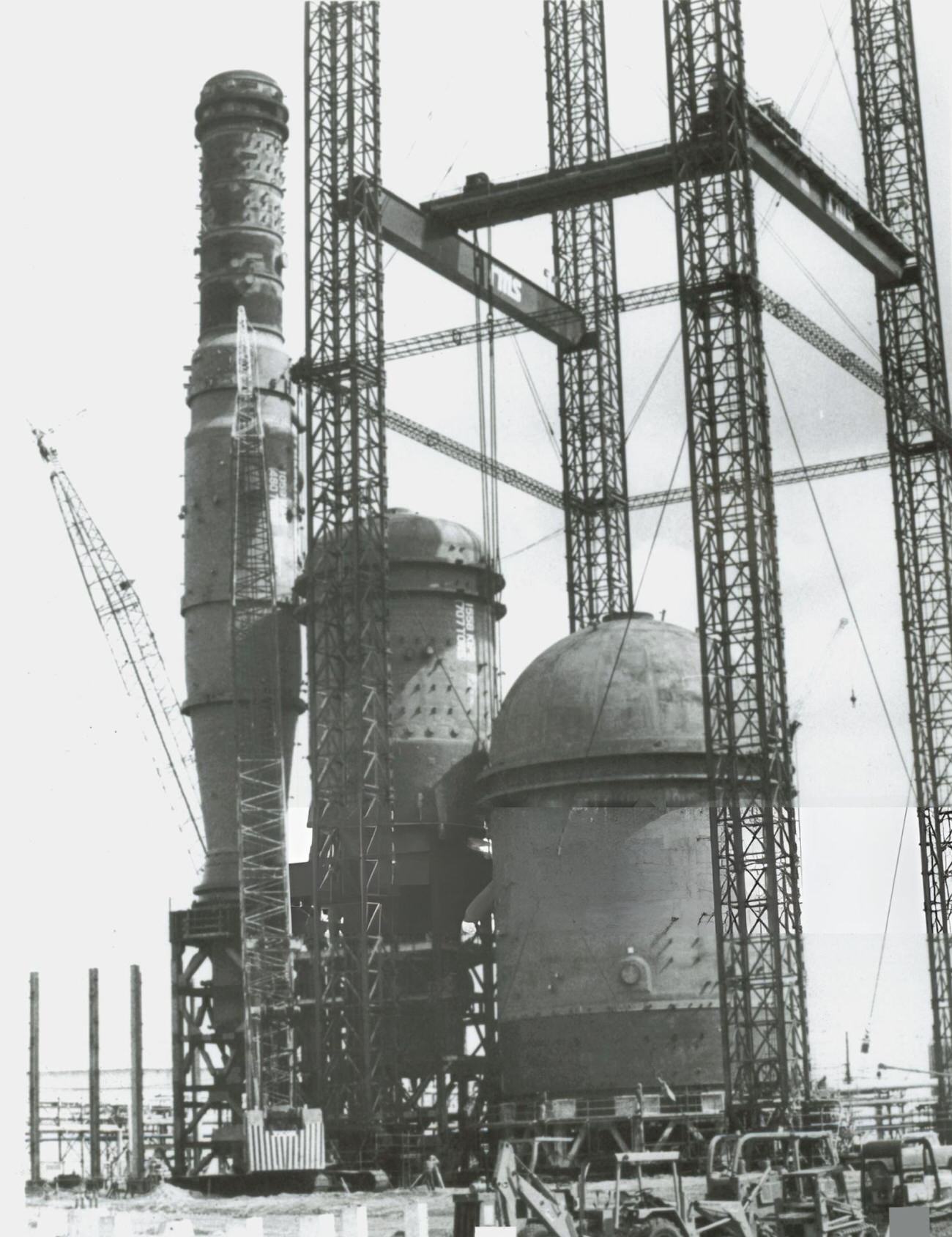 Three domed vessels are installed at Exxon Company USA's Baytown refinery, part of an upgrade project to process crude oil more efficiently, Houston, Texas, 1987.