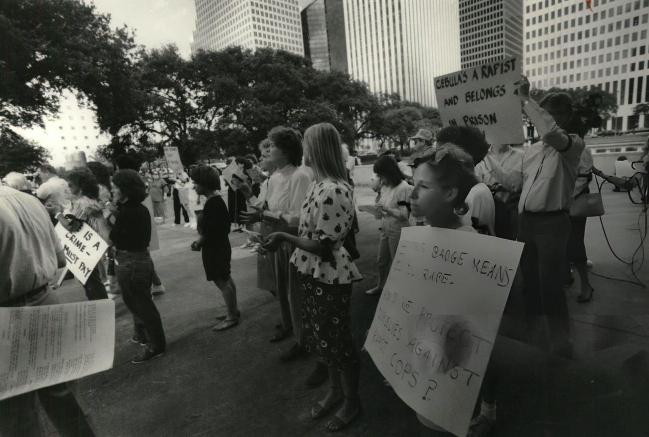 Houston Area Woman's Center holds a protest rally in front of city hall against former police officer James Cebula's probated sentence, Houston, 1980s