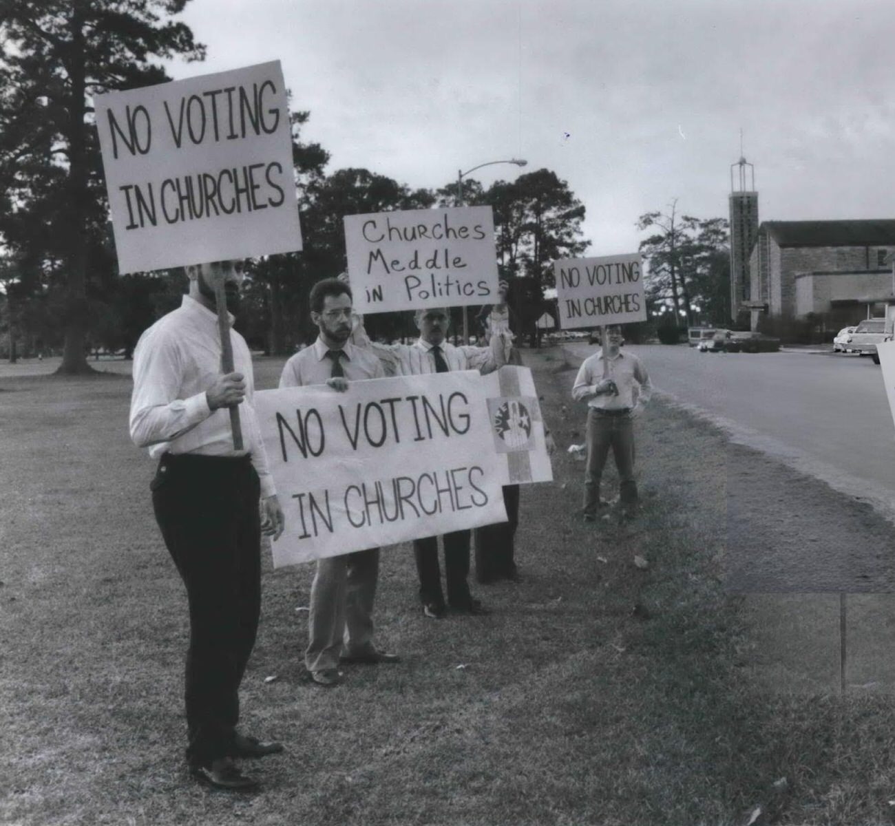 American Atheists protest outside St. Theresa Catholic Church against churches being used as polling places, Houston, Texas.