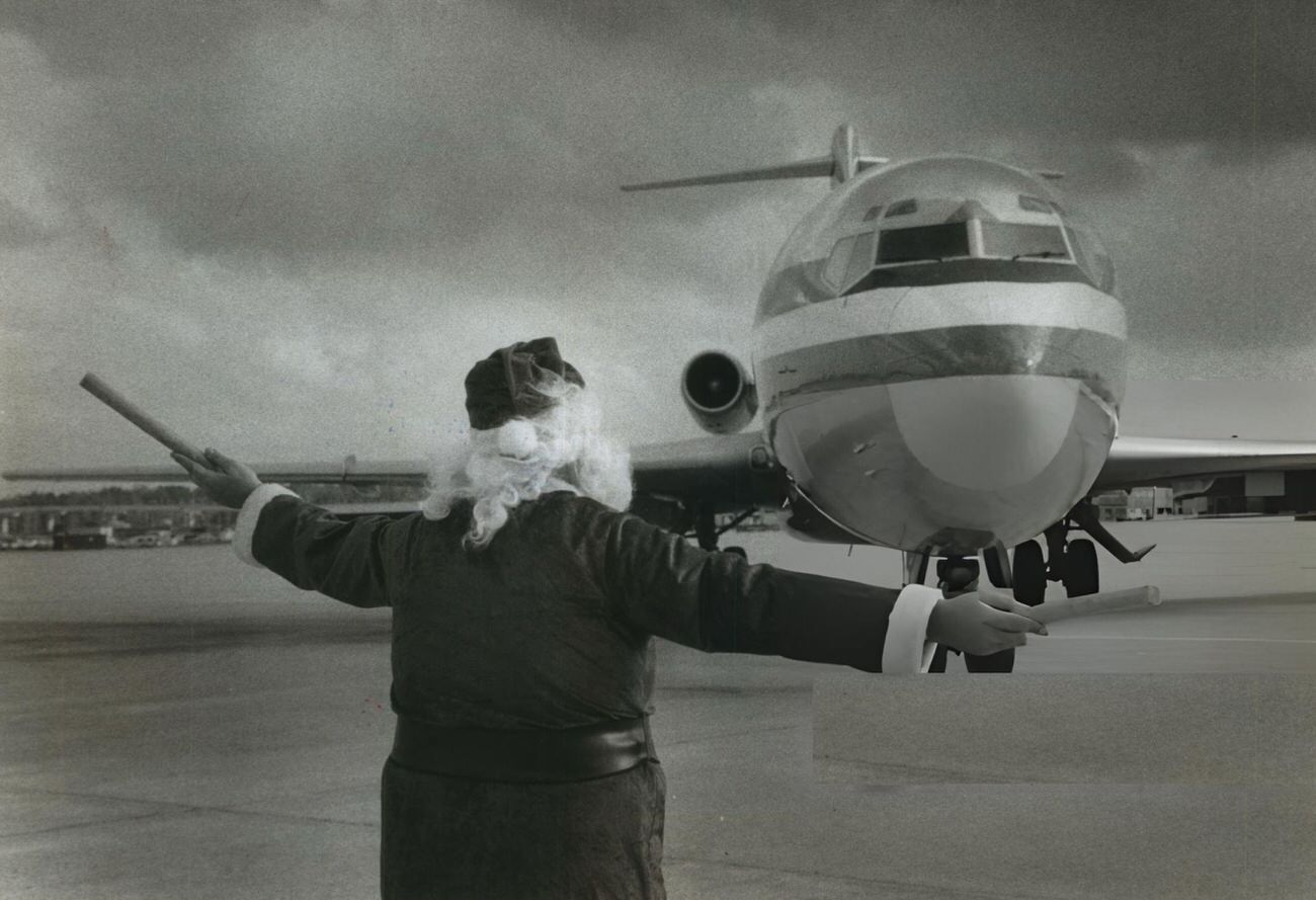 George Bird, an American Airlines employee, dresses as Santa to help direct traffic at Houston Intercontinental Airport.
