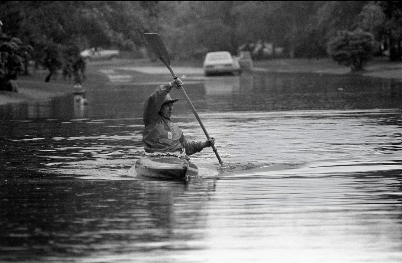 Bob Olson uses a kayak on flooded Empress Drive near Edgebrook after heavy rains in Houston, Texas, May 3, 1981.