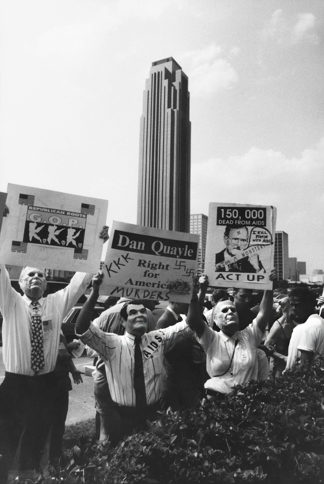 ACT UP activists' protest on August 20, 1992, wearing Ronald Reagan and George H.W. Bush masks, criticizes government inaction on AIDS and conservative policies, showcasing the era's political and health activism, Houston, Texas.
