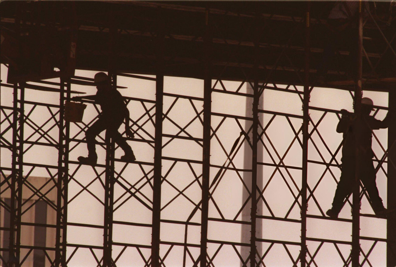 Construction workers perform maintenance on Beltway 8 at I-45, Houston, Texas, 1999.