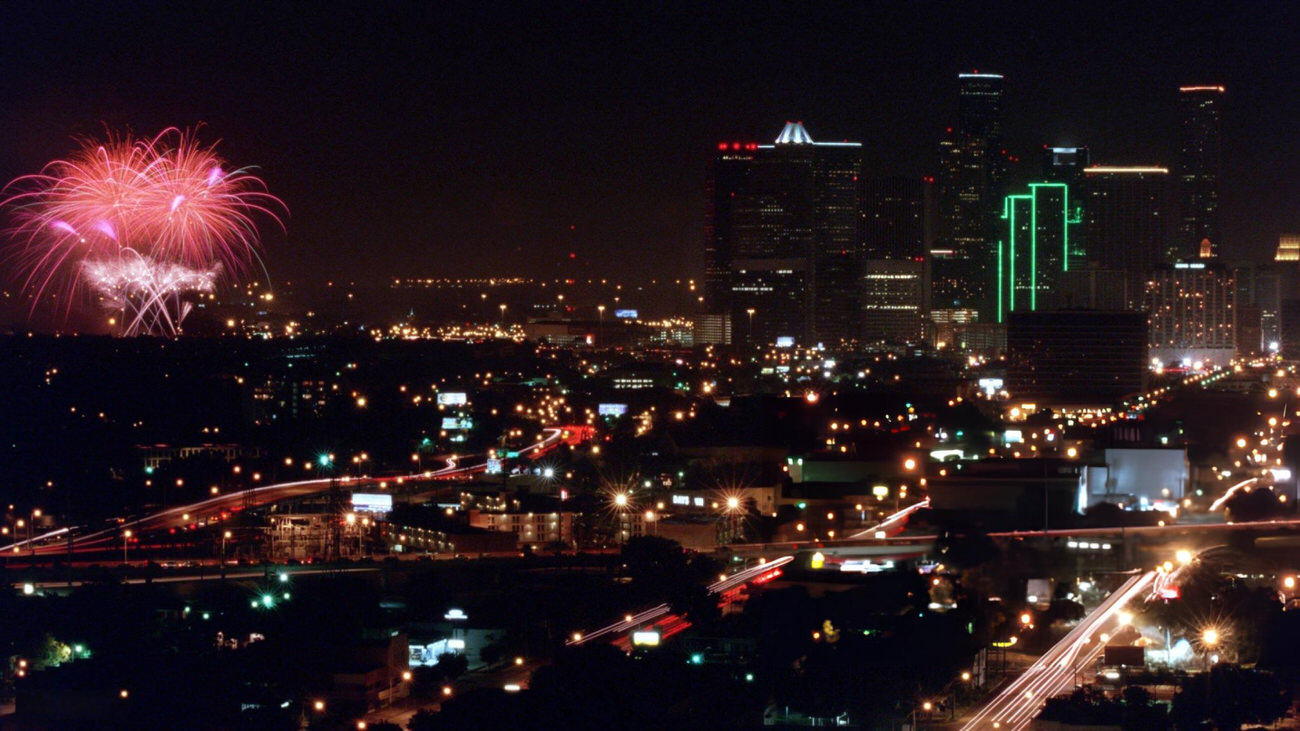 Fireworks near downtown during the Independence Day celebration viewed from Warwick Towers, Houston, Texas, 1999.