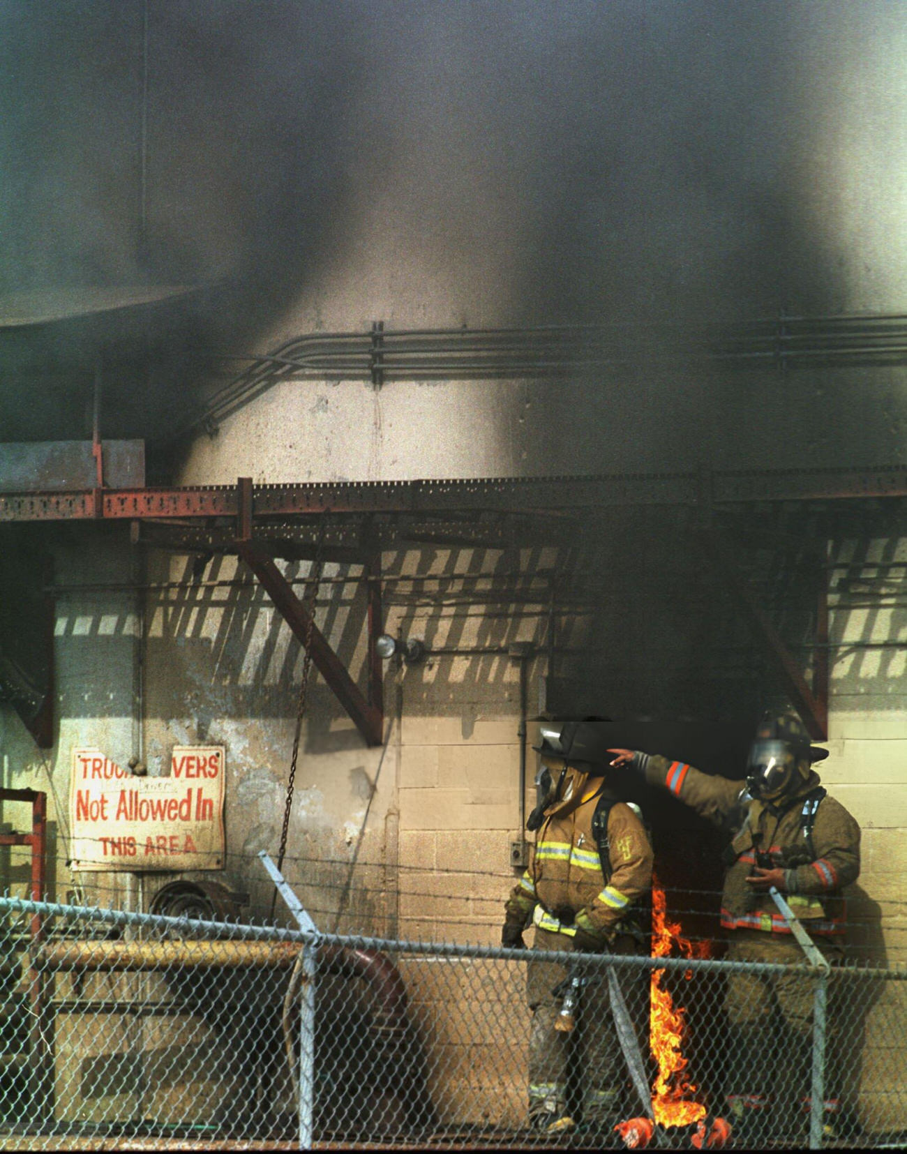 Houston firefighters battle a 2-alarm fire at Schoenhamm Produce warehouse, Houston, Texas, 1999.
