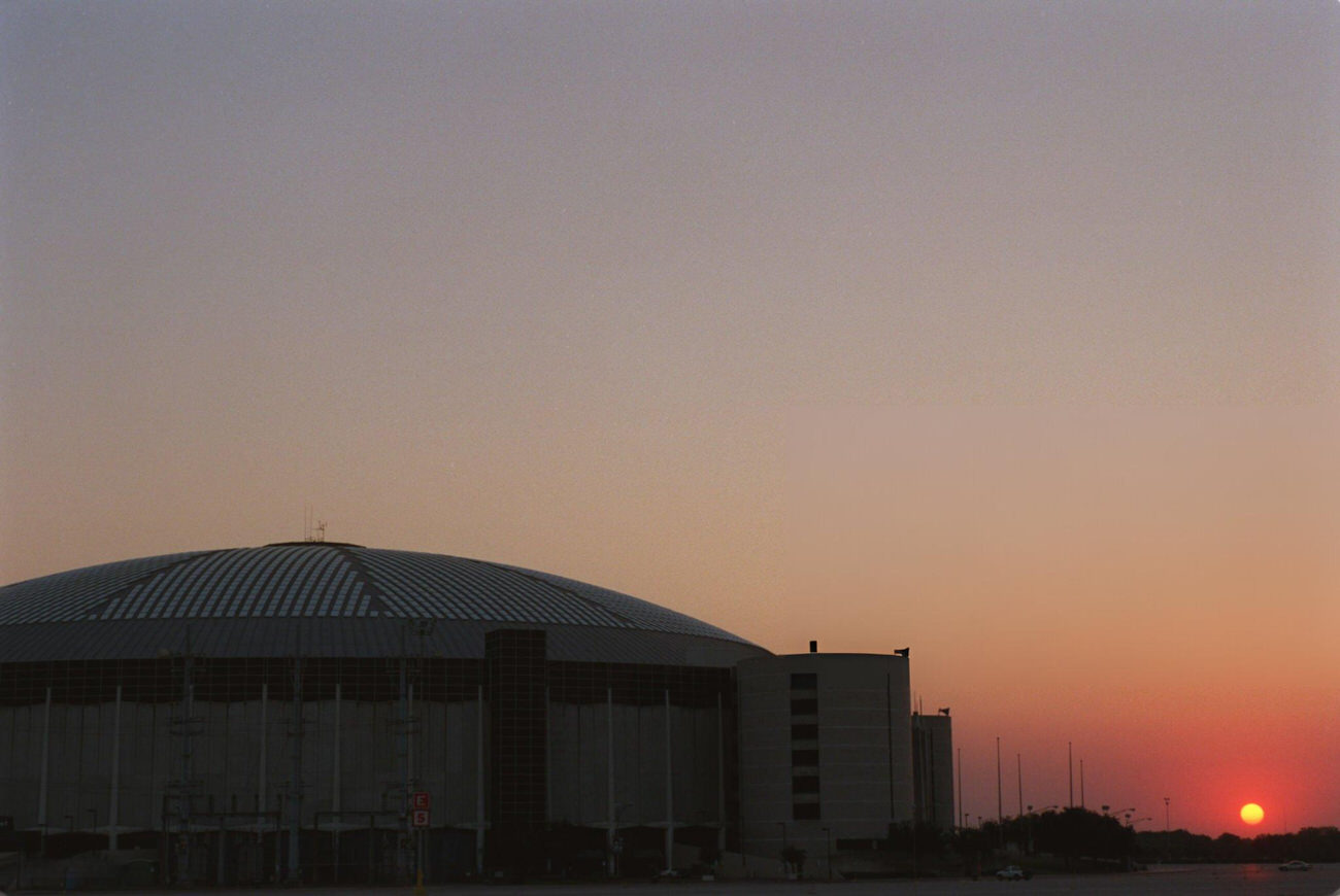 The Astrodome at sunset, marking the end of its era as a sports venue, Houston, Texas, 1999.