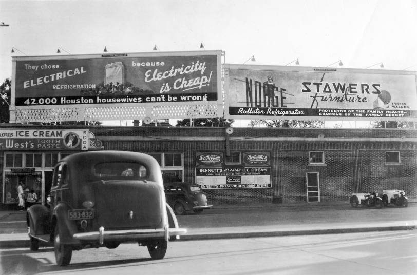 Billboards on a grocery store roof, 1940s