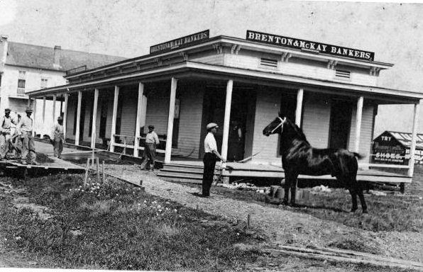 Brenton & McKay Bankers building with men and a horse, 1940s