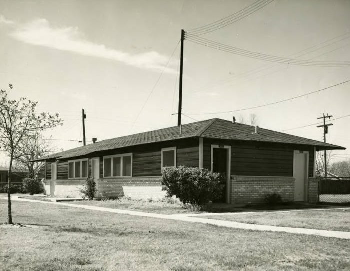 Building in Bellaire, Texas with external restrooms, 1950s.