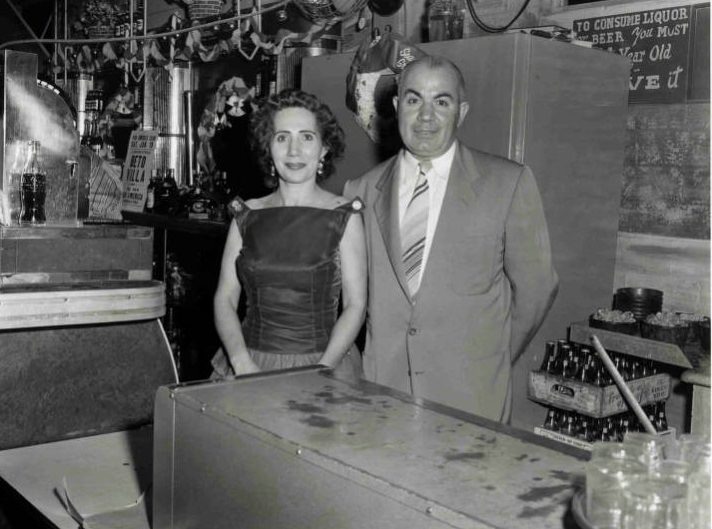 Couple behind bar at Pan America nightclub, 1950s.