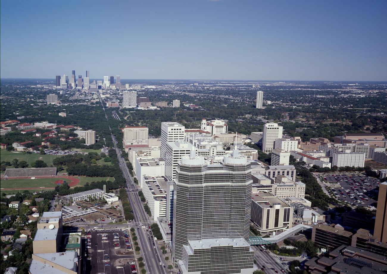 Aerial view of the Texas Medical Center with Houston skyline in the background, 1990s
