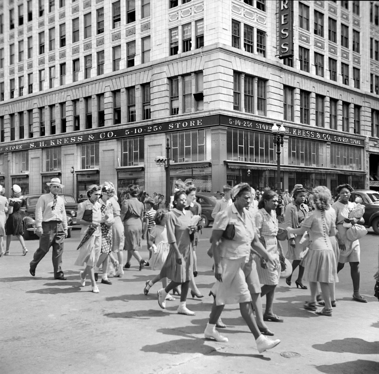 Crowd of pedestrians on a downtown street in Houston, Texas, 1943.