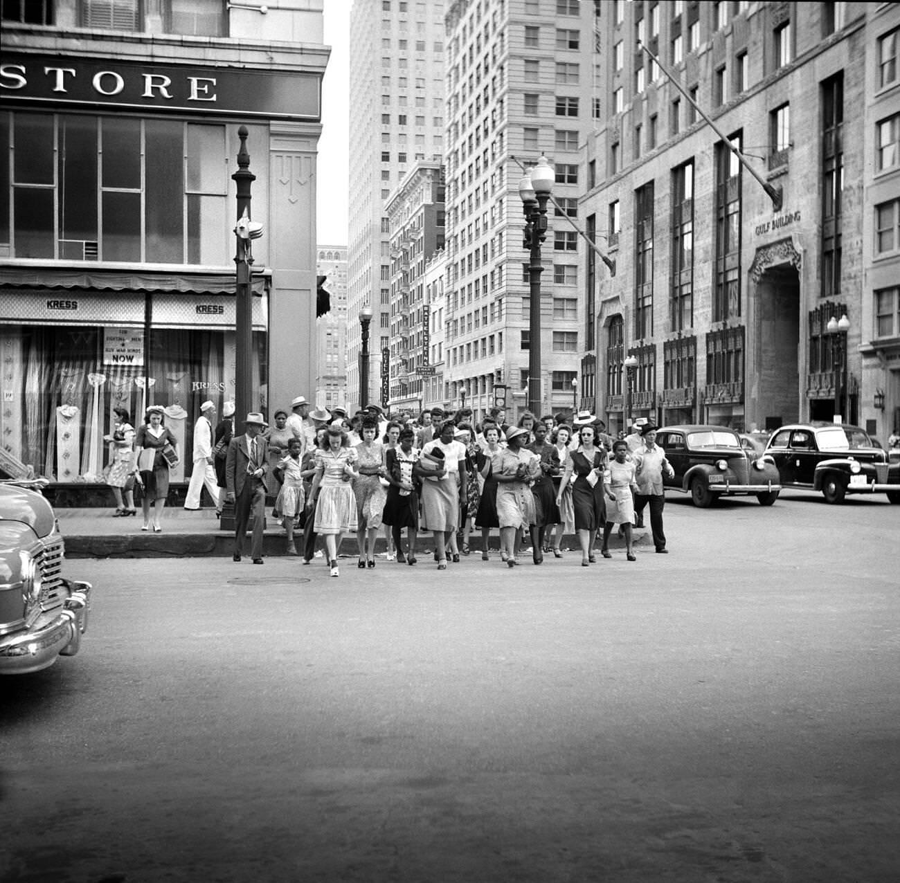 Crowd of pedestrians on a downtown street in Houston, Texas, 1943.