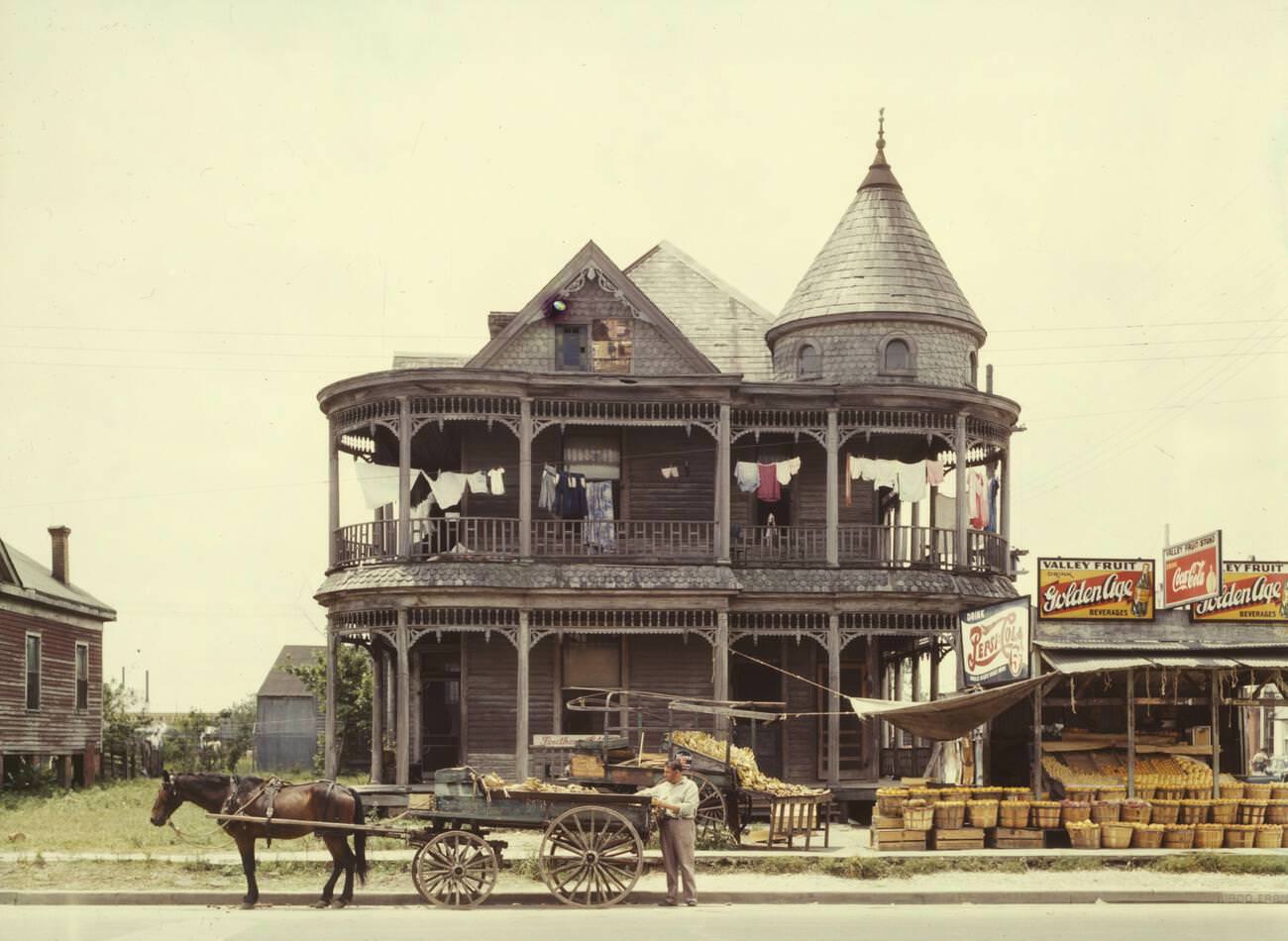 House in Houston, Texas, featuring a fruit stall with Pepsi-Cola and Valley Fruit Golden Age Beverages signs.
