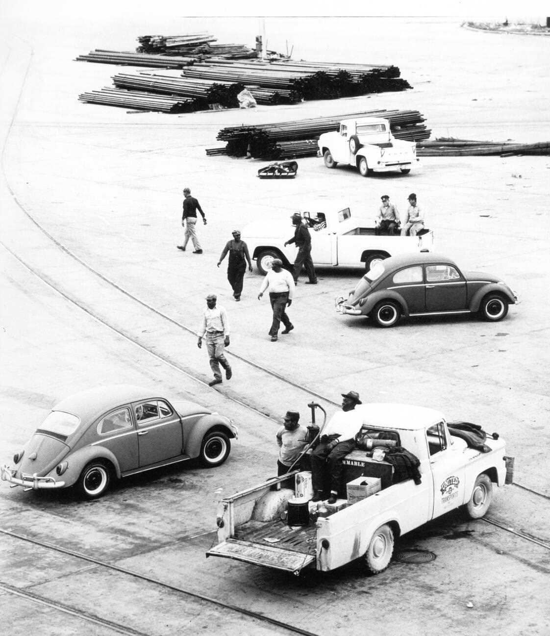 Volkswagen Beetles being refueled at the Houston harbor after importation, 1960s.