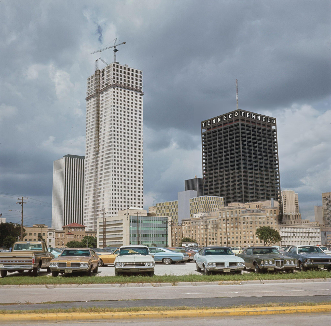 Skyscrapers including the Tenneco Building rise above a downtown Houston parking lot, Texas, circa 1970.