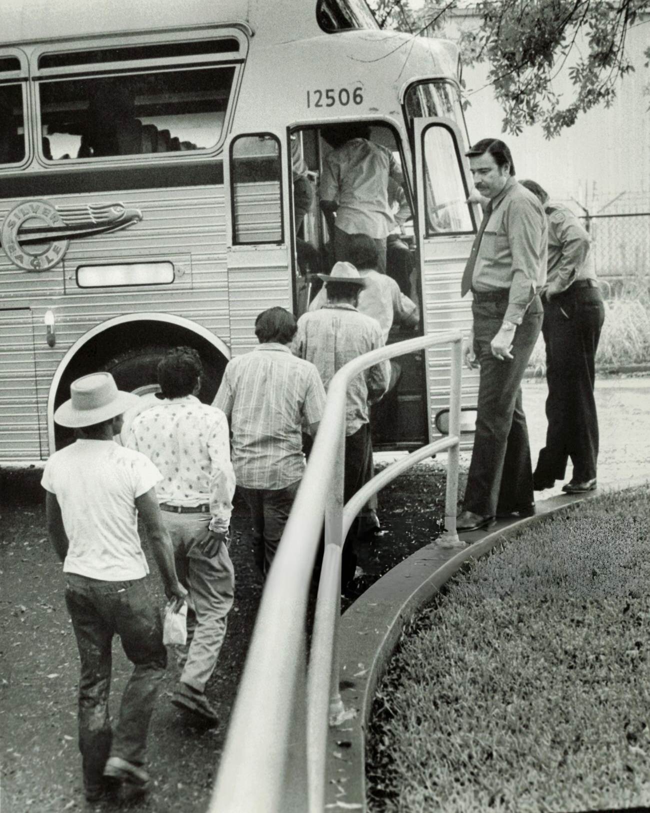 Immigration officials supervise the return of illegal immigrants to Mexico from Houston, Texas, 1977.