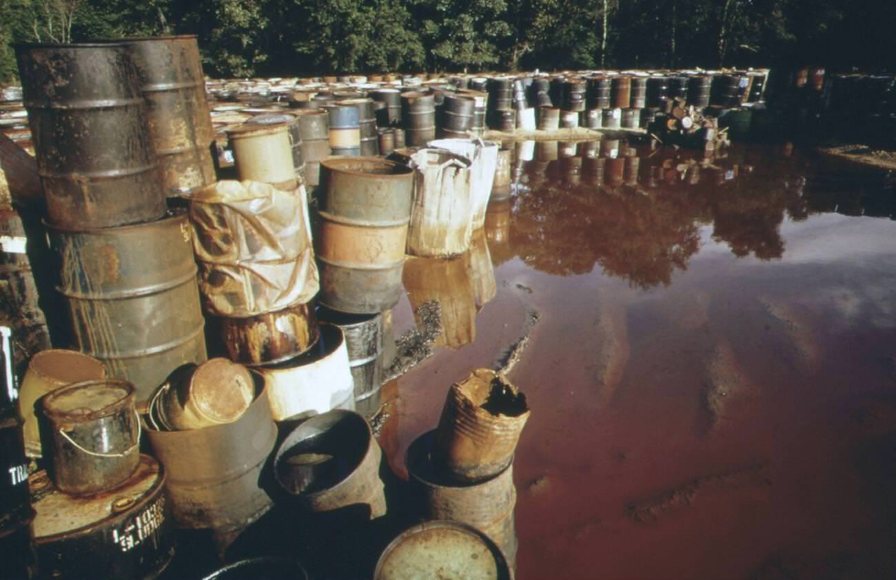 Hazardous industrial wastes stored in a swampy field near Ville Platte, Louisiana, trucked from the Houston-Beaumont area, June 1973.