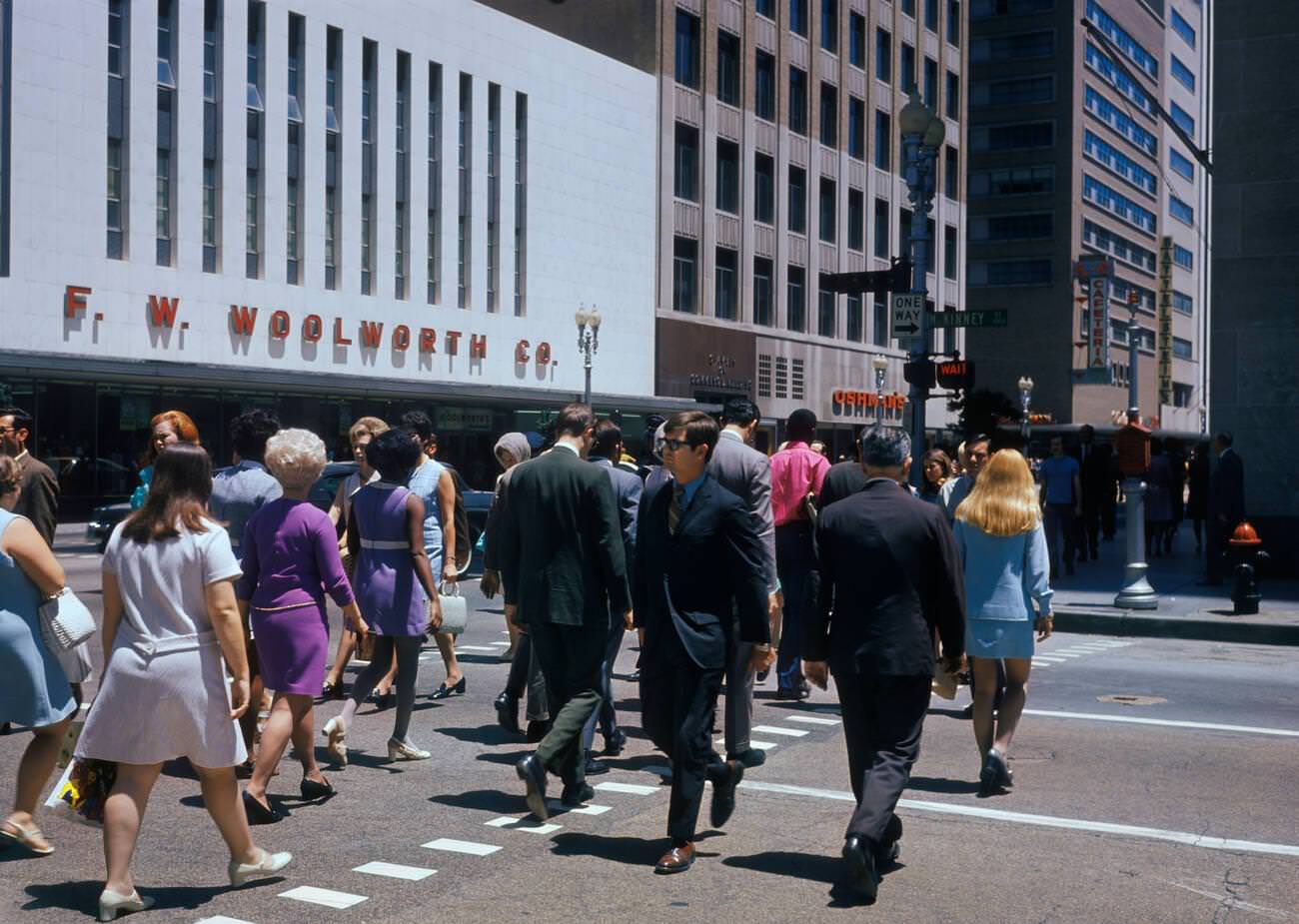 Crowd crossing McKinney Street at Main Street in Houston, Texas, 1970s.