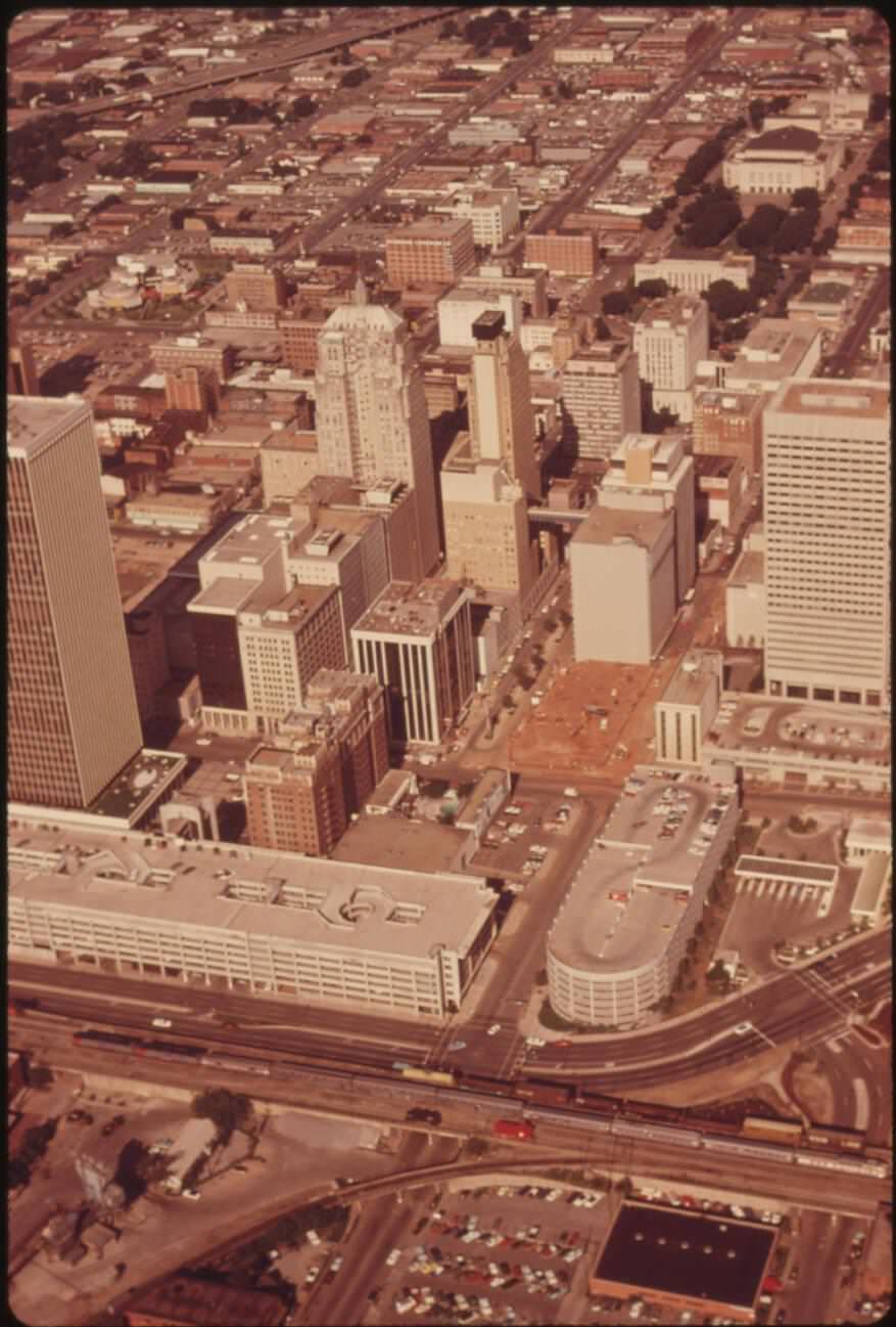 Amtrak's Lone Star en route from Chicago to Houston through downtown Oklahoma City, highlighting rail travel innovations, 1970s.