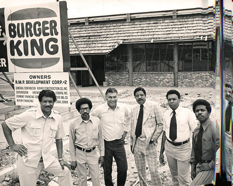 Judson Robinson, Jr. with men at Burger King site, 1970s