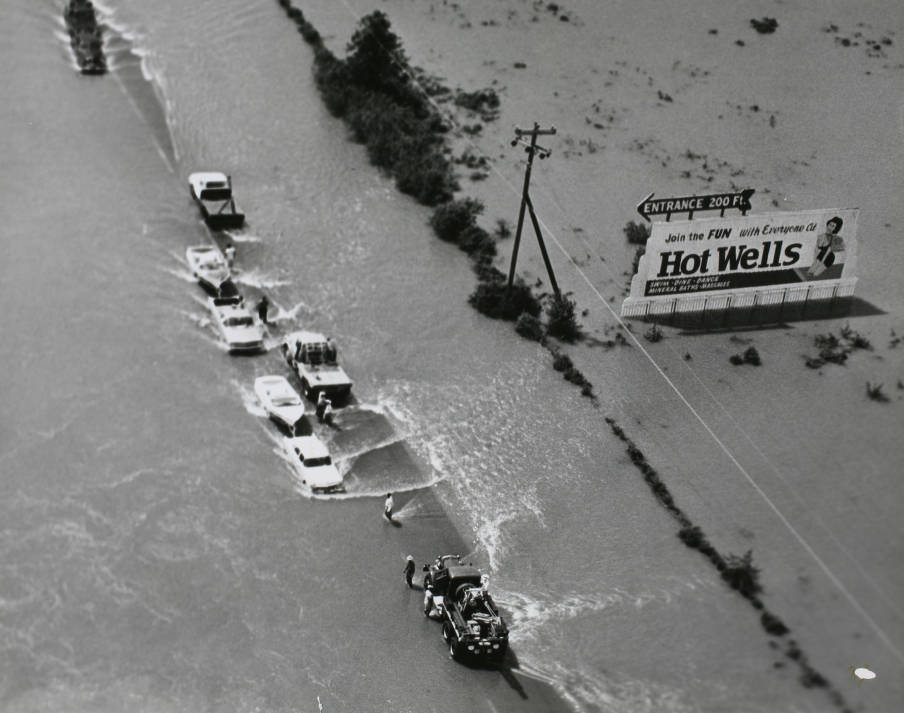 Flood with vehicles and boats, Houston, 1960.