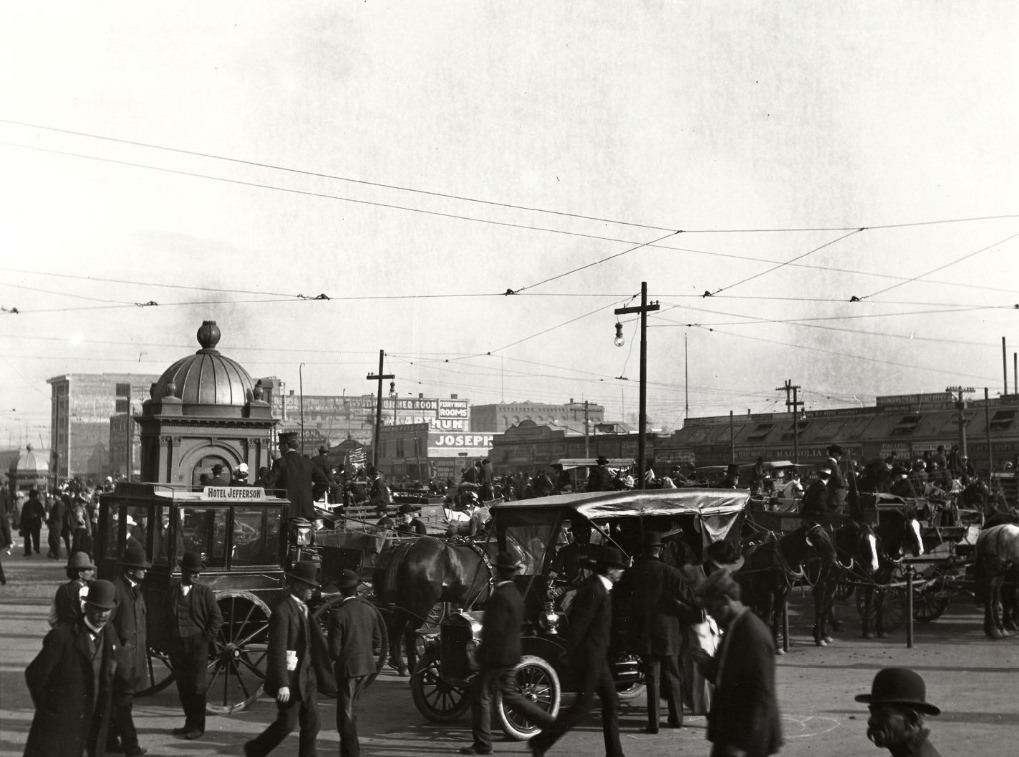 Horse-drawn carriages in front of the Ferry Building, circa 1915.