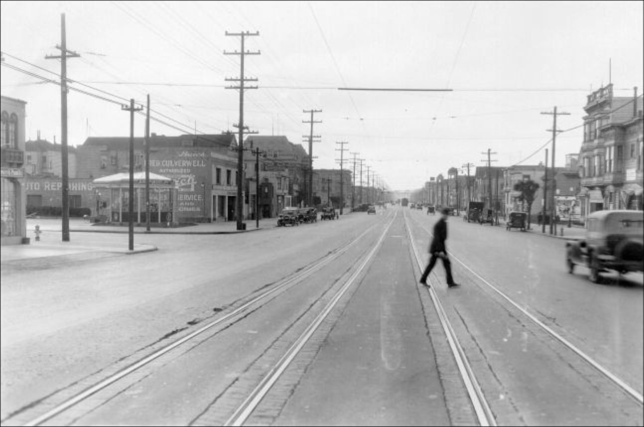 Man crossing train tracks on Geary Street at 4th Avenue, 1926