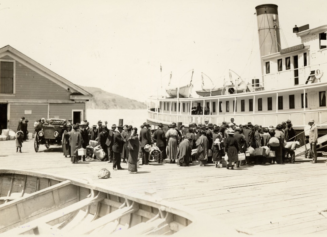 Crowd of people on a dock at Angel Island in 1920.