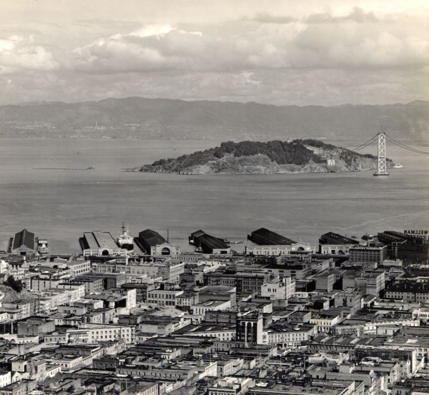 View of the piers, Yerba Buena Island, and the Bay Bridge under construction in the 1930s