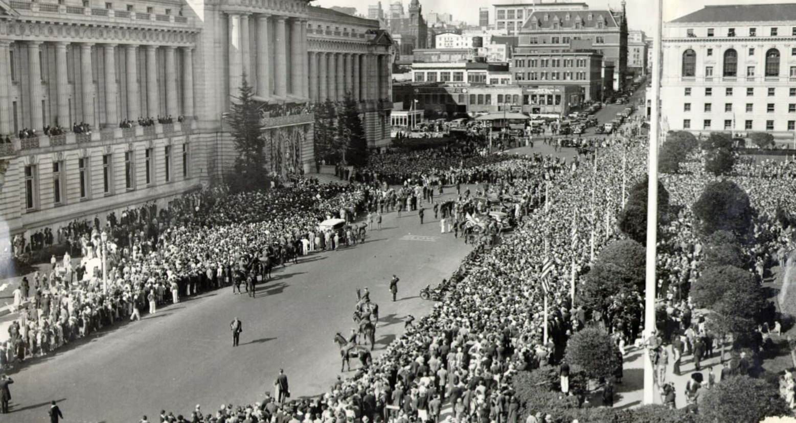 Large crowd of people gathering in front of City Hall in the Civic Center, 1932