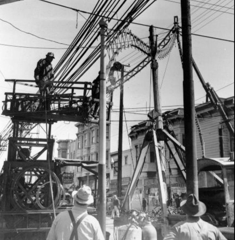 Metal arches on Fillmore Street being dismantled for scrap metal, 1943