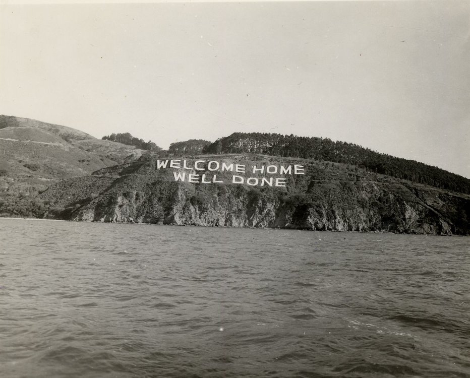 'WELCOME HOME WELL DONE' sign on Angel Island for WWII returnees, 1940s